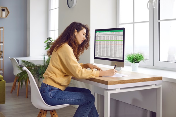 Female analyst working with spreadsheet data