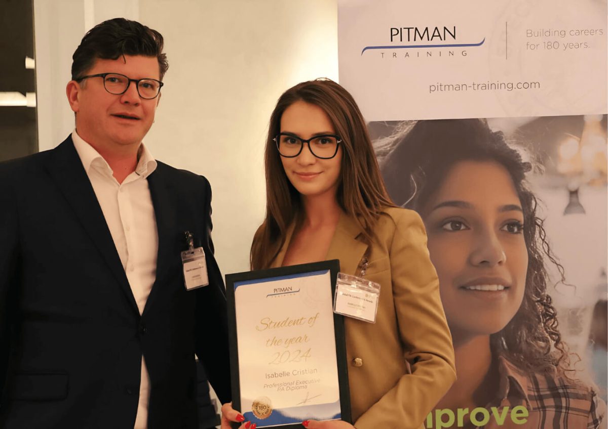 Isabelle Christian receives Student of the Year award Isabelle Christian receives Student of the Year award from Chris Hodson at Pitman Training London