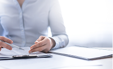 Person working with accounting documents Person working with accounting documents